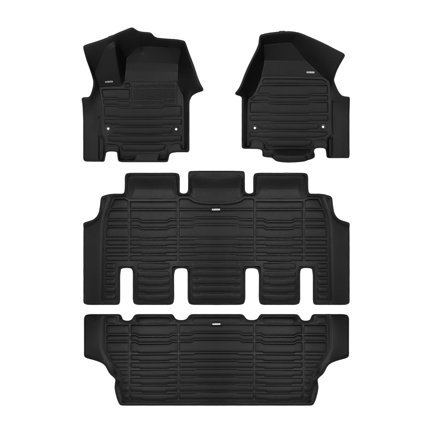 A set of black TuxMat car floor mats for Chrysler Grand Caravan models.