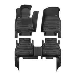 A set of black TuxMat car floor mats for BMW X7 models.