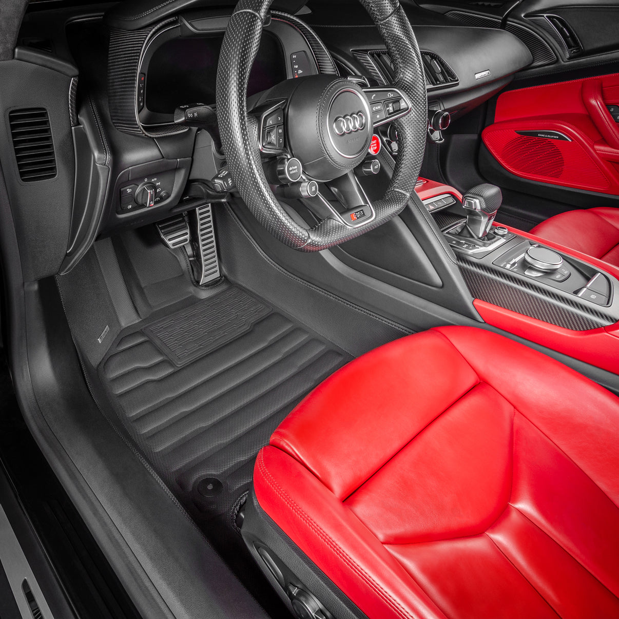 A set of black TuxMat car floor mats for Audi R8 models.

