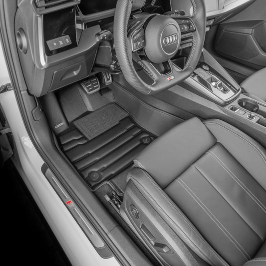 A set of black TuxMat car floor mats for Audi S3/RS3 models.