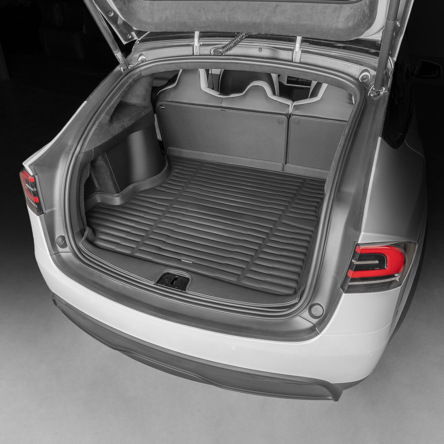 A set of black TuxMat trunk floor mats for Tesla Model X models.
