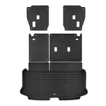 A set of black TuxMat trunk mats for Toyota Grand Highlander models.
