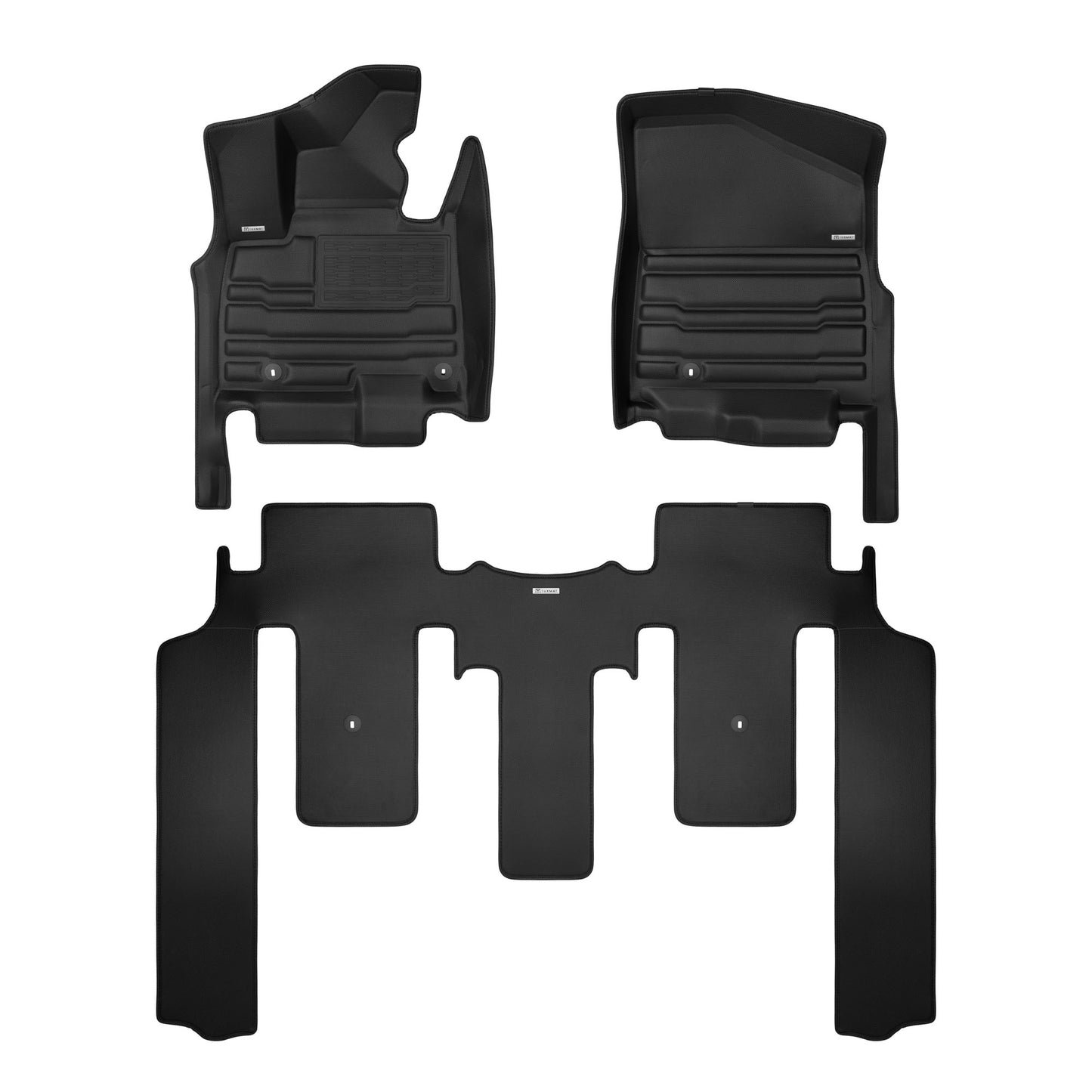 A set of black TuxMat car floor mats for Kia Carnival HEV models.