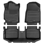 A set of black TuxMat car floor mats for Kia Forte models.