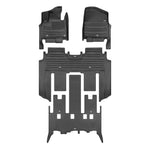 A set of black TuxMat car floor mats for Kia Carnival models.