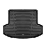 A set of black TuxMat trunk mats for Nissan Versa models.